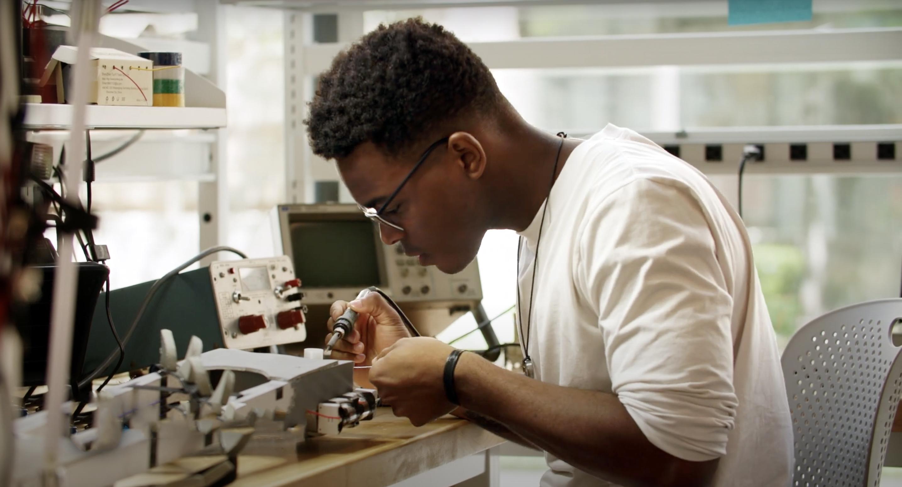 a man works on lab equipment