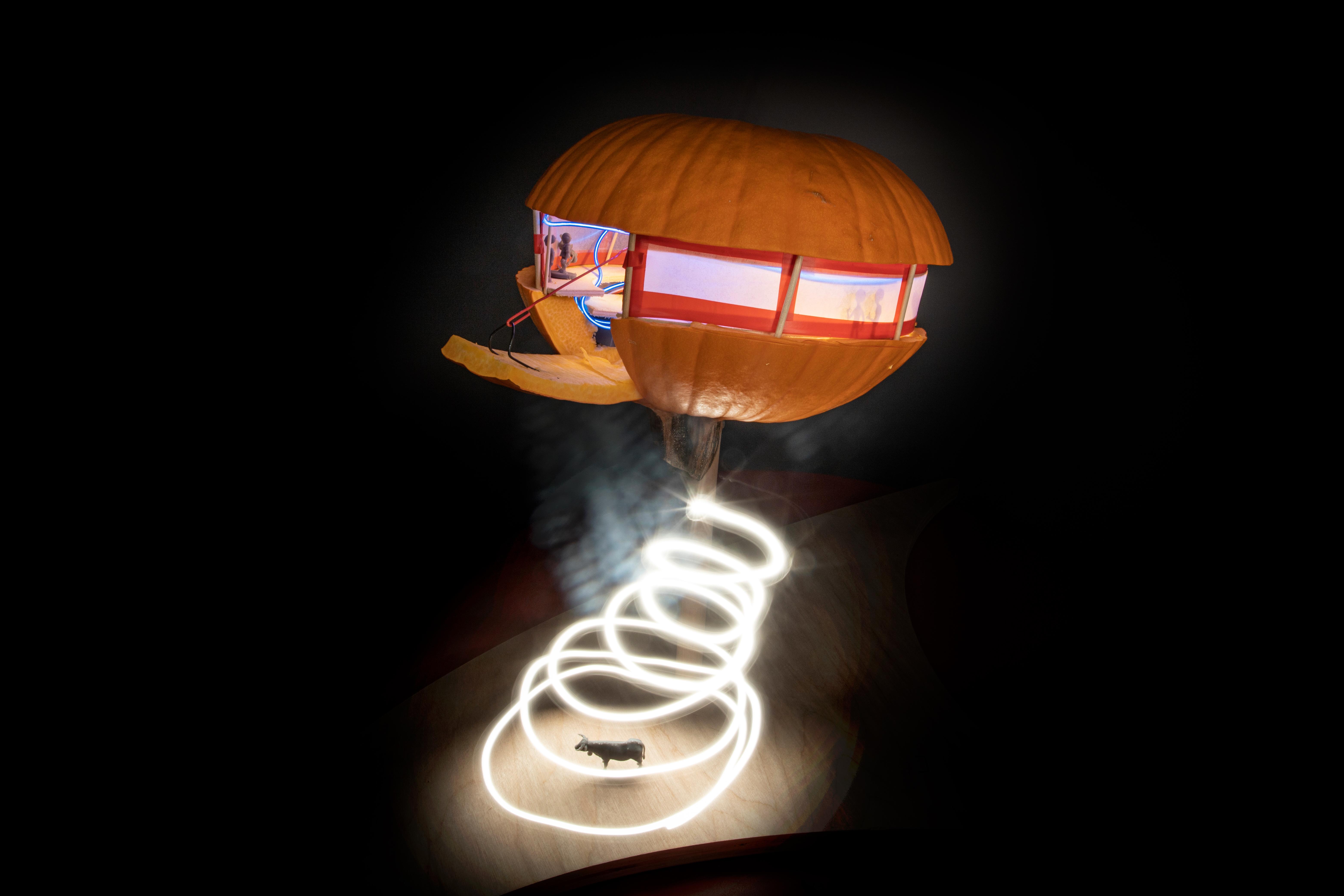 artwork showing a pumpkin-themed spaceship