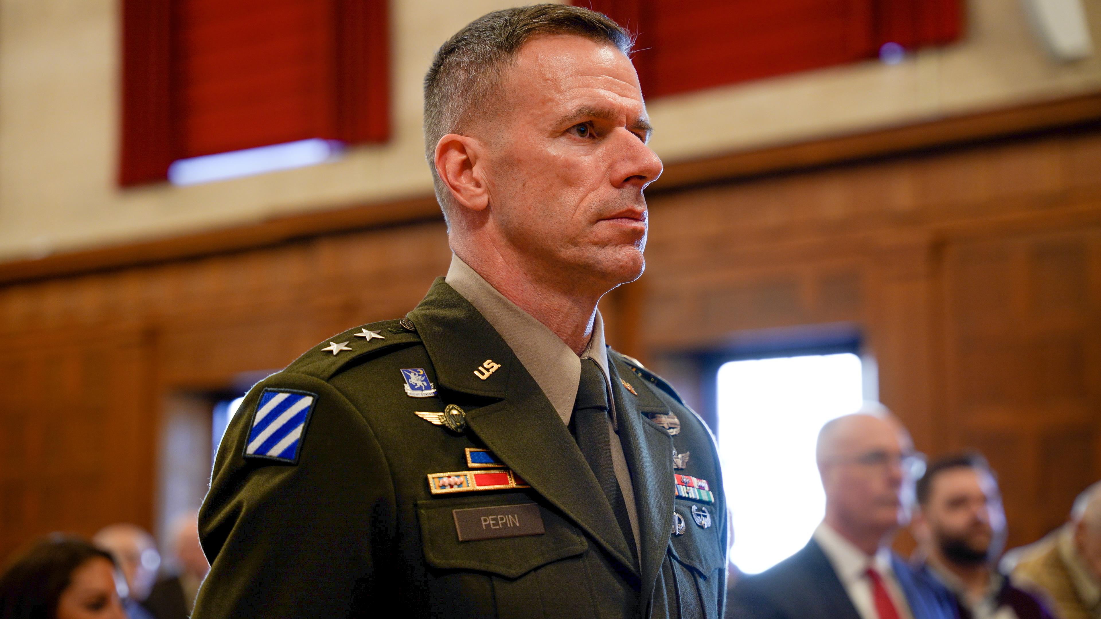 a man in military uniform looks ahead
