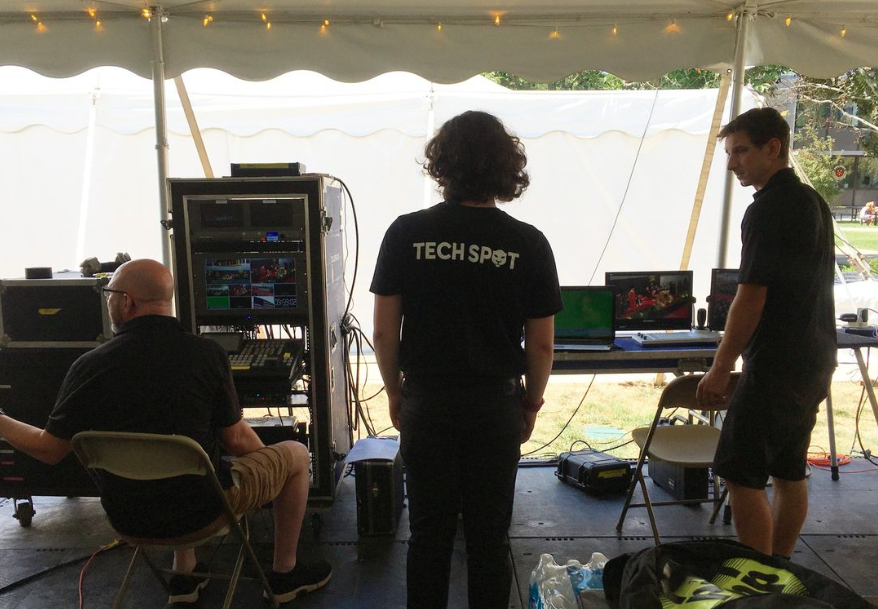 Student working on audio video support in the 2022 commencement