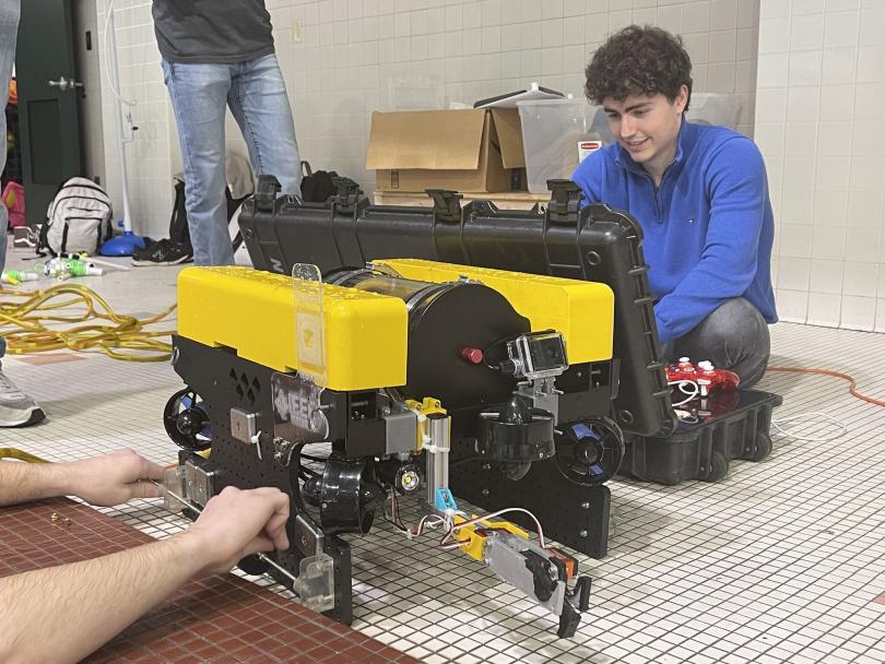 student works on a robot