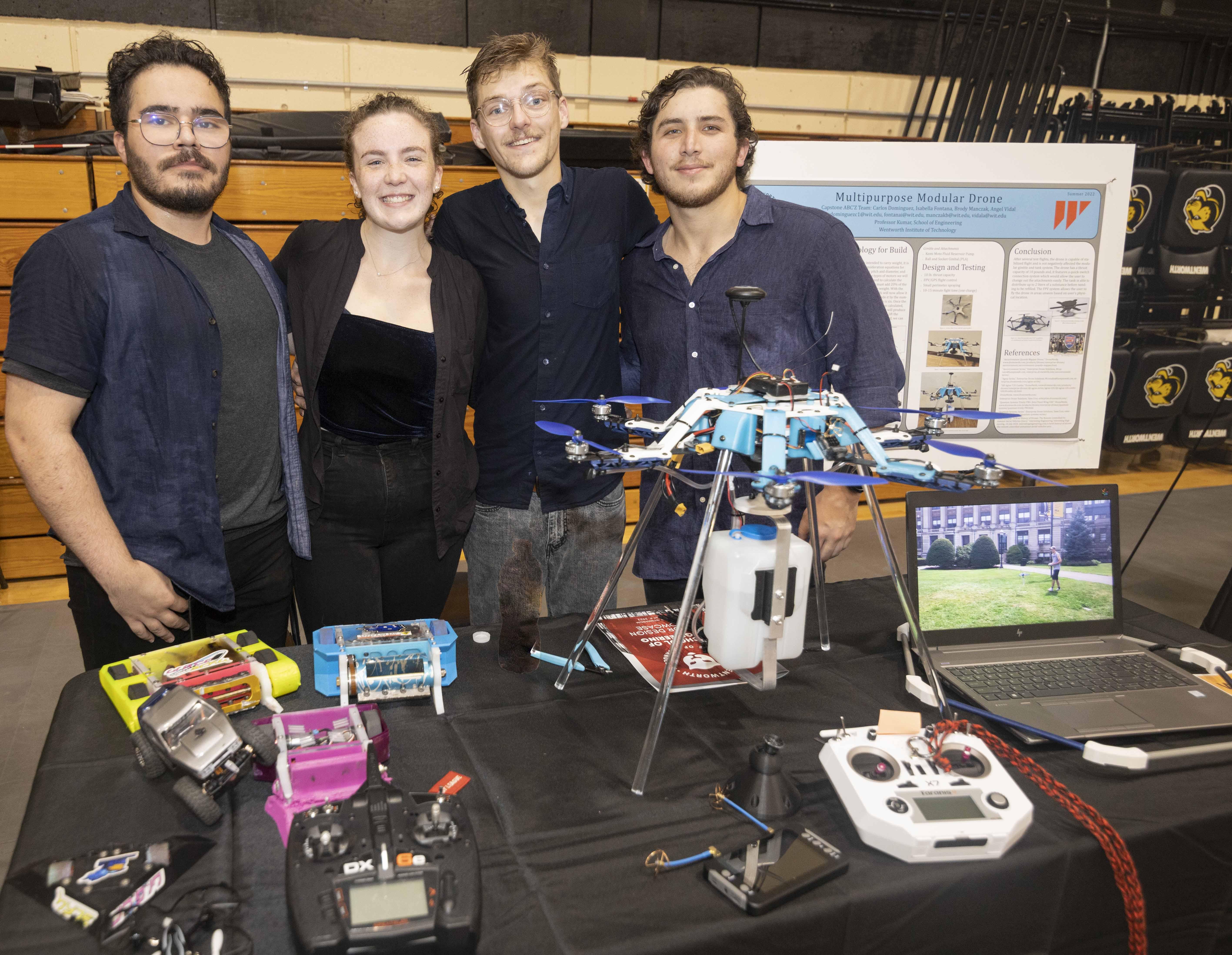 students standing with a robotic drone