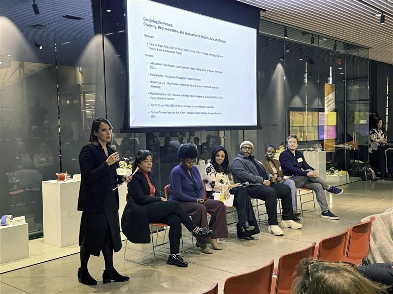 a panel of speakers at an event