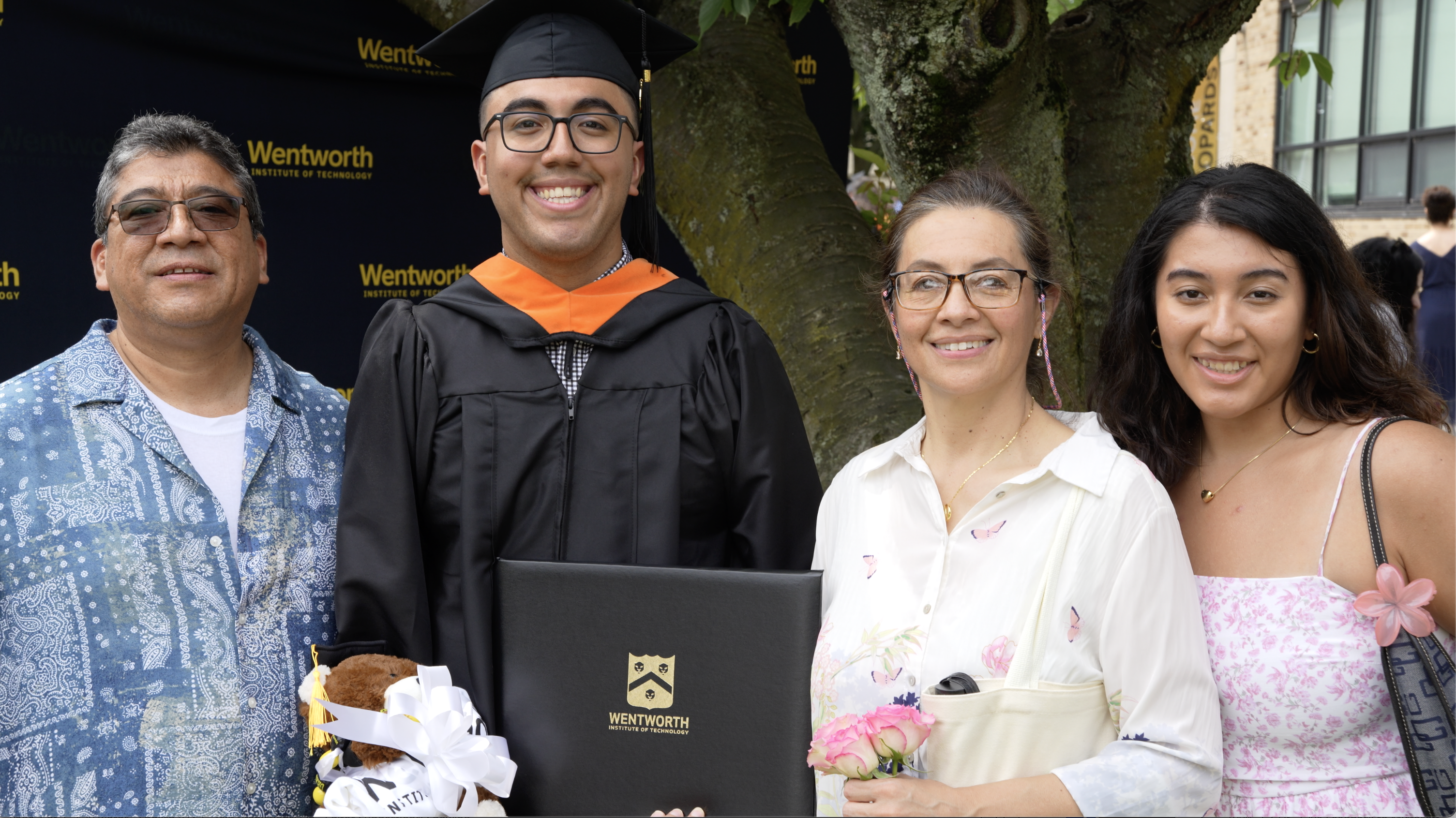 a smiling family at a graduation ceremony