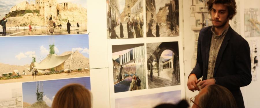 man presenting architectural work to a group of people