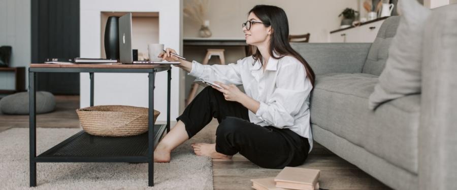 woman sitting in front of table and computer