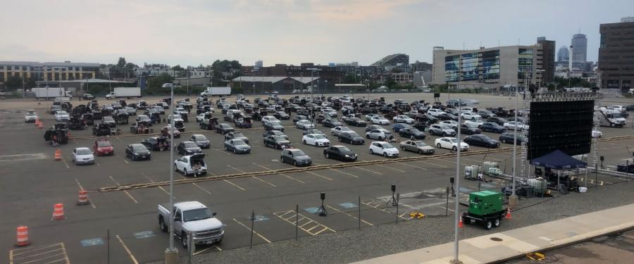 cars parked for a drive-in movie theater