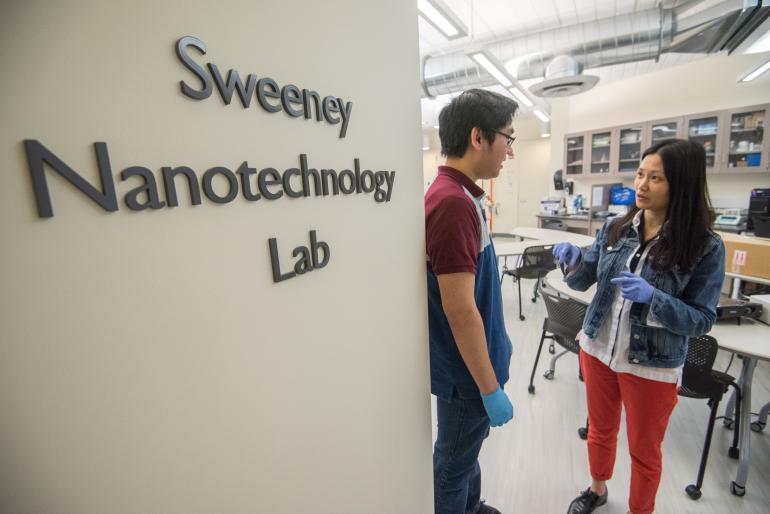 Two students outside Nanotechnology Lab