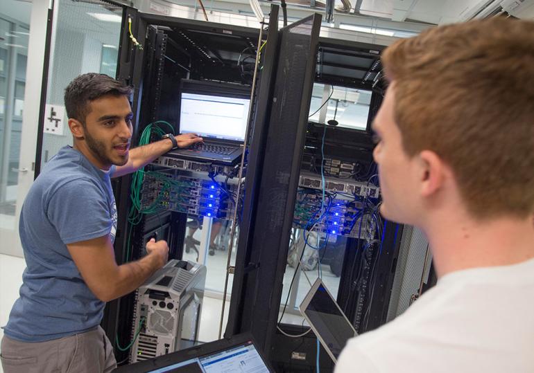Two students looking into server