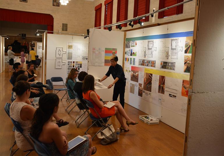 Student presenting work in Interior Design Expo