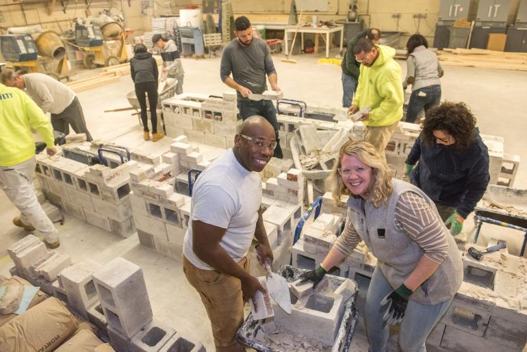 people working in concrete lab