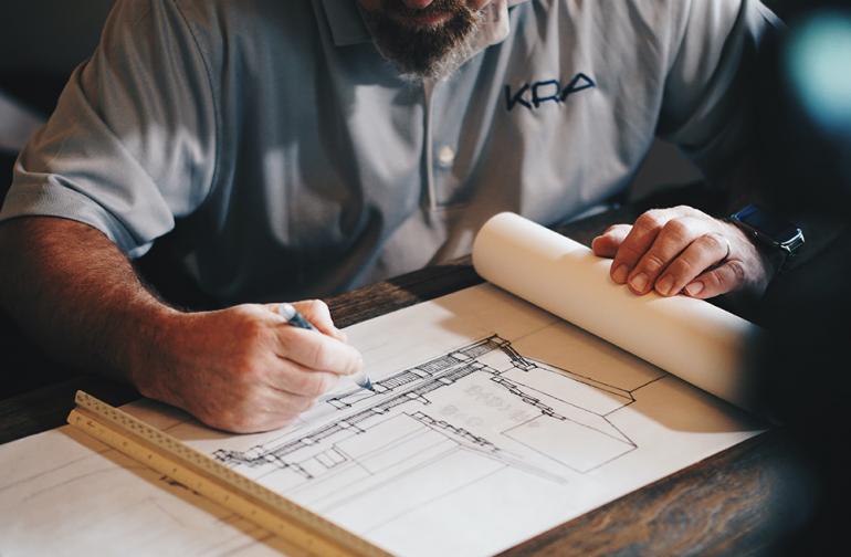 Man reviewing construction blueprints.