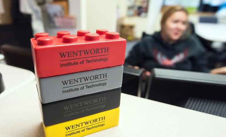 A stack of lego building blocks, branded with Wentworth's logo.
