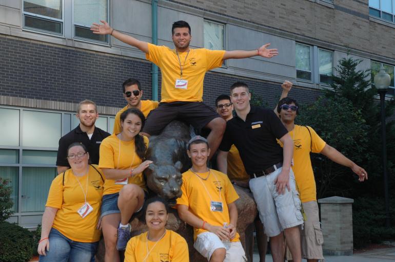 Group of students welcoming new students and families to campus.