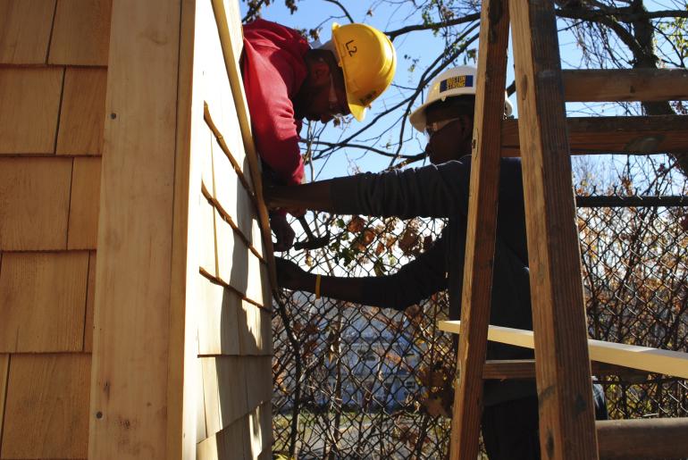 Students building a community shed.