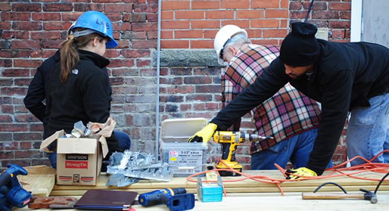 Students build a deck in Mission Hill