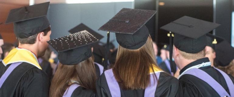 students in graduation caps and gowns