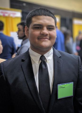 A young man poses for the camera.