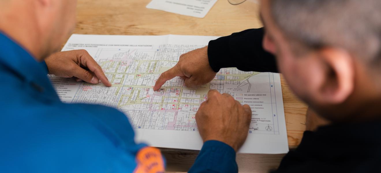 two men reviewing a blueprint