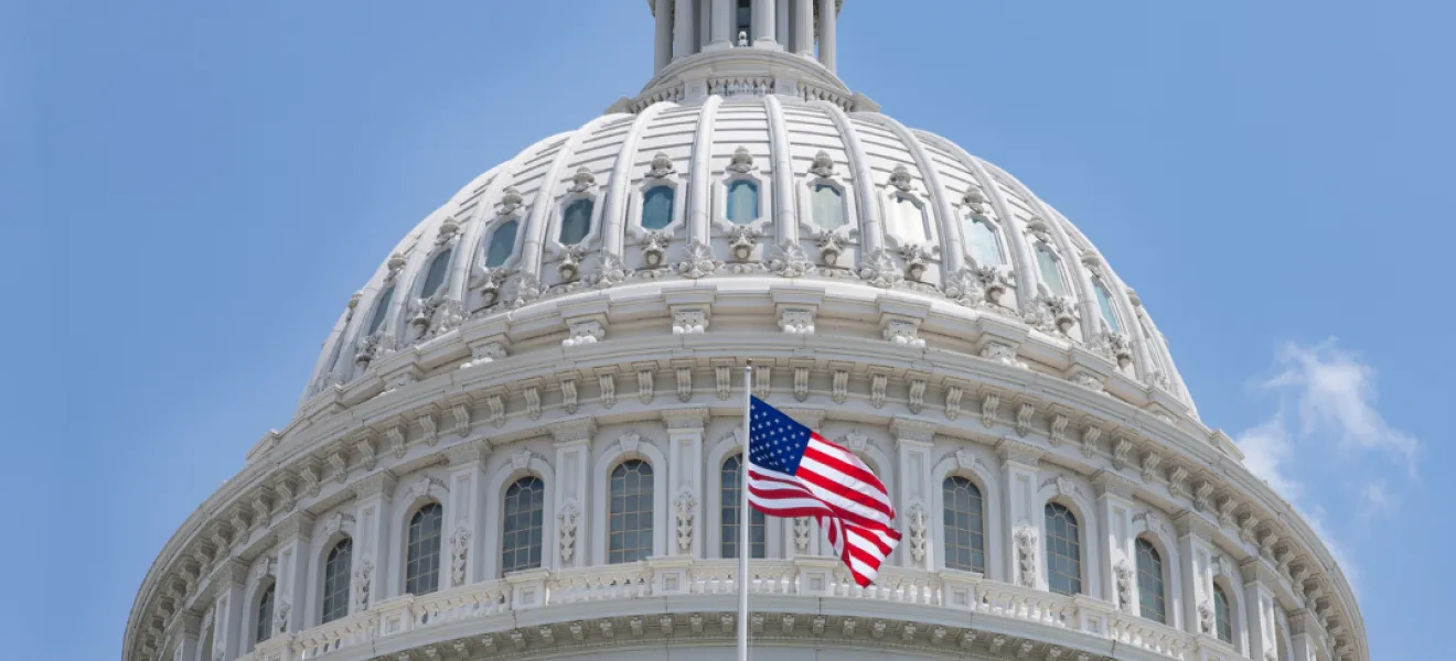 american flag outside the united states capitol building