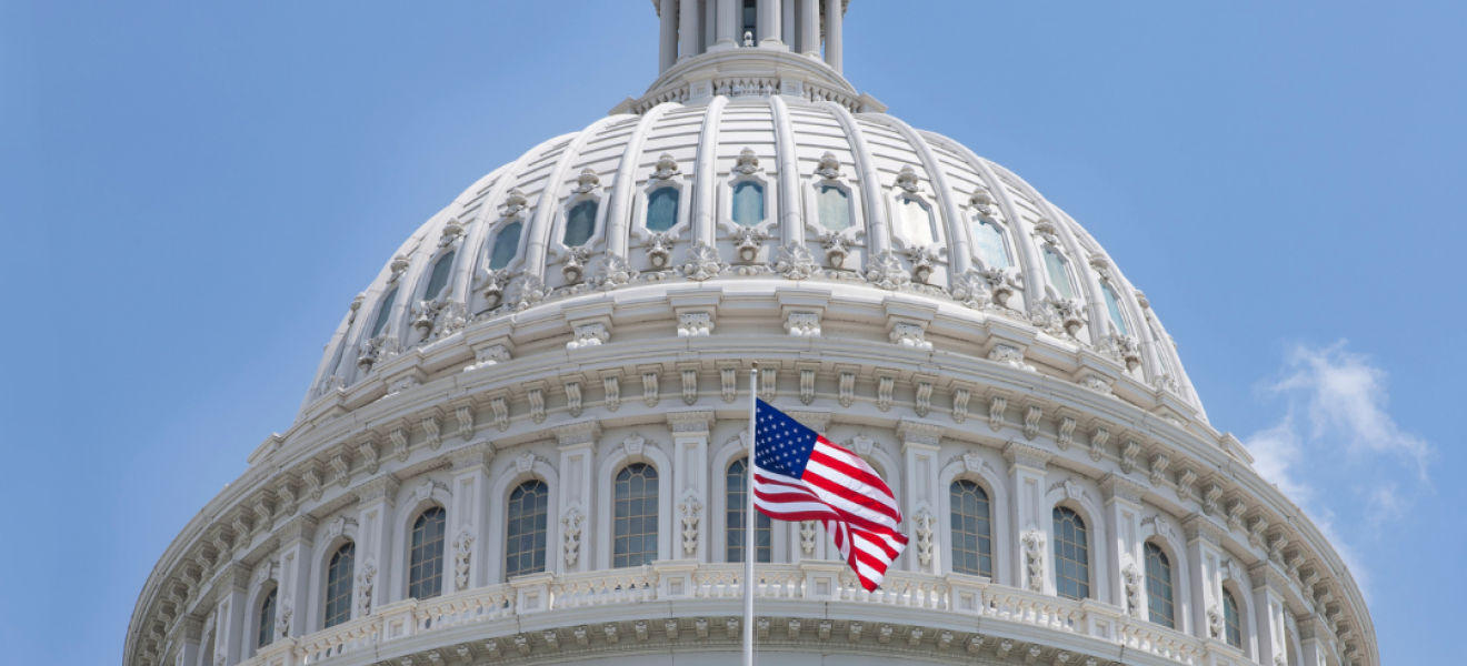 american flag outside the united states capitol building