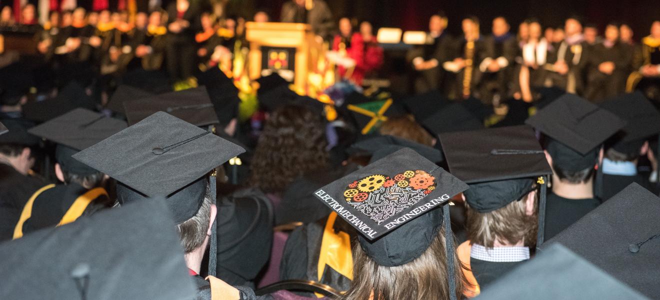 group of people wearing graduation caps