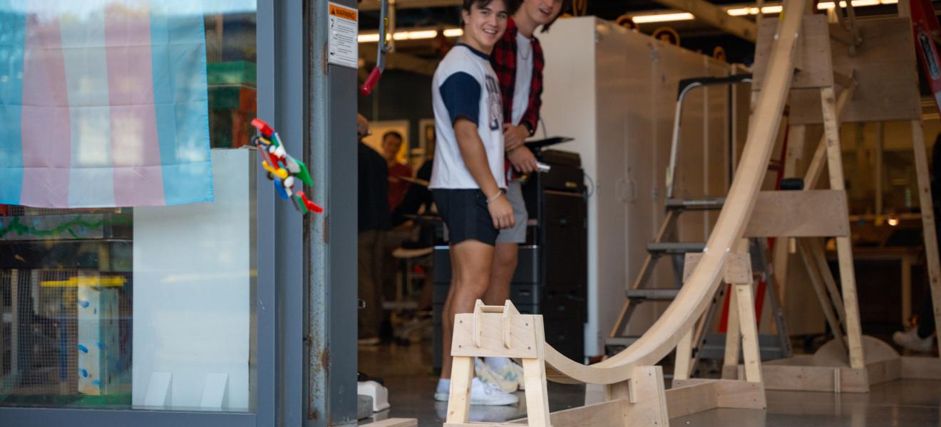 students launch toy car off of ramp
