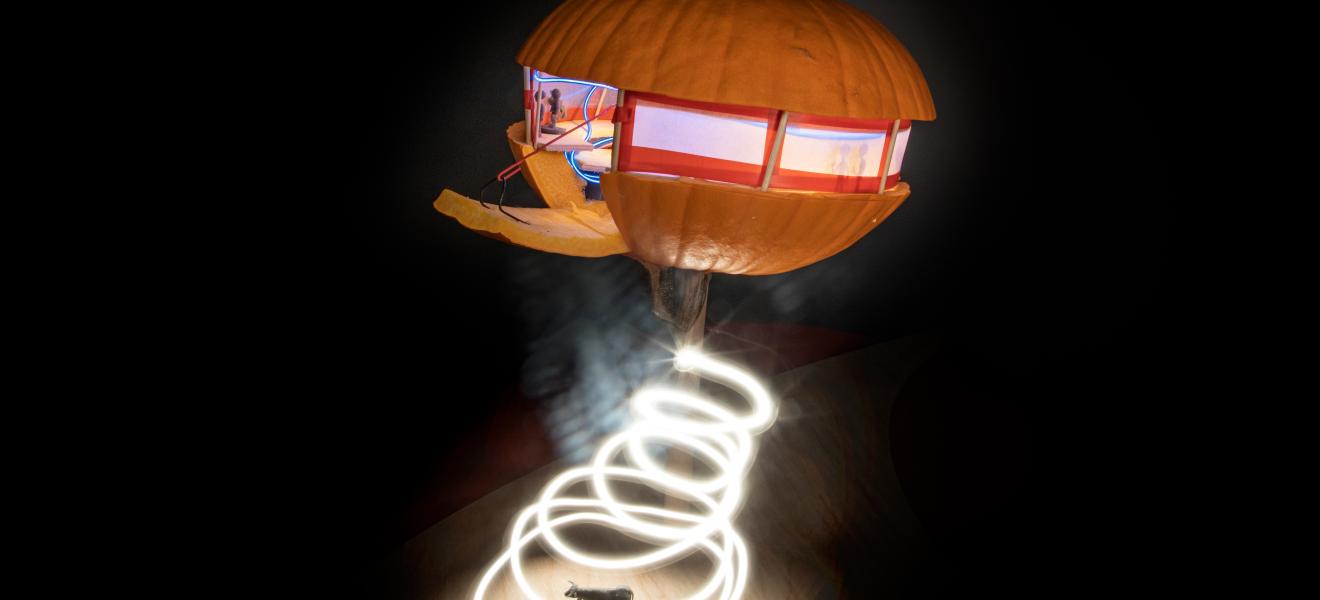 artwork showing a pumpkin-themed spaceship