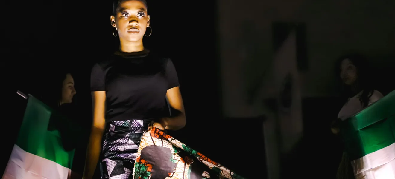 person modeling clothes on a runway