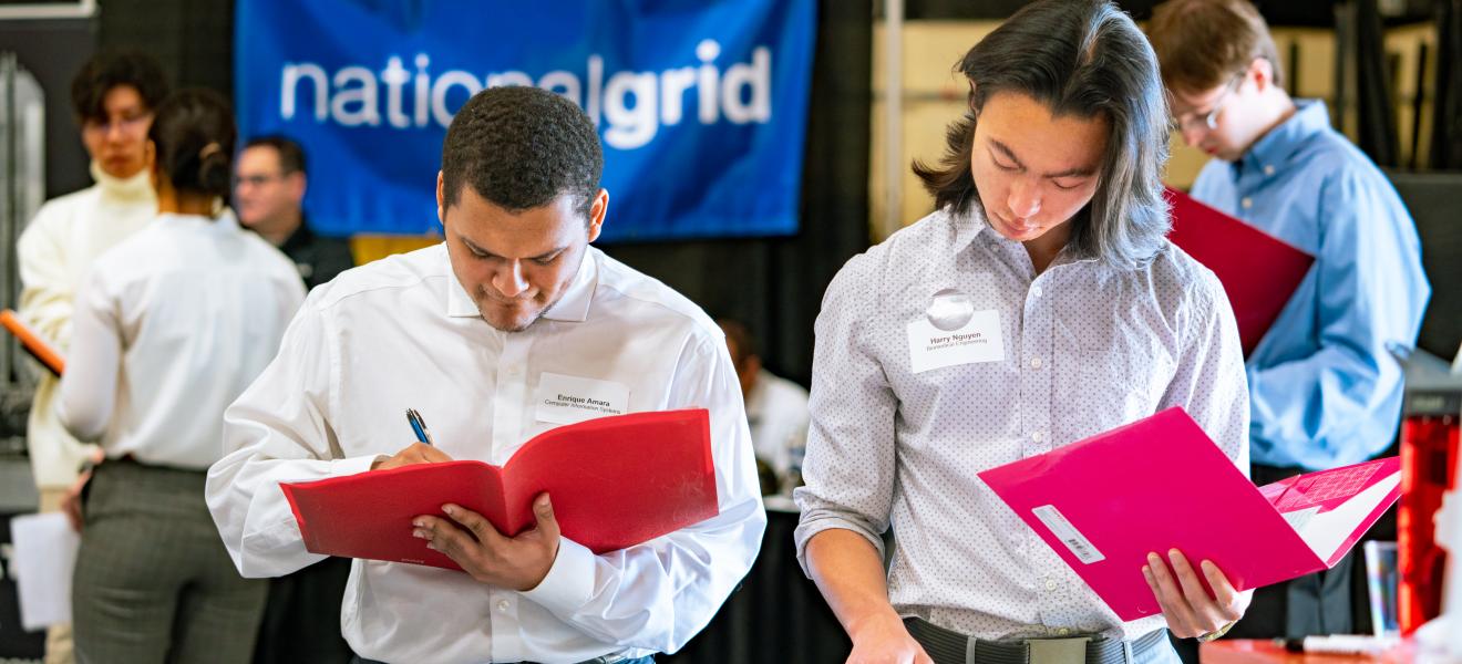 two students looking at resumes