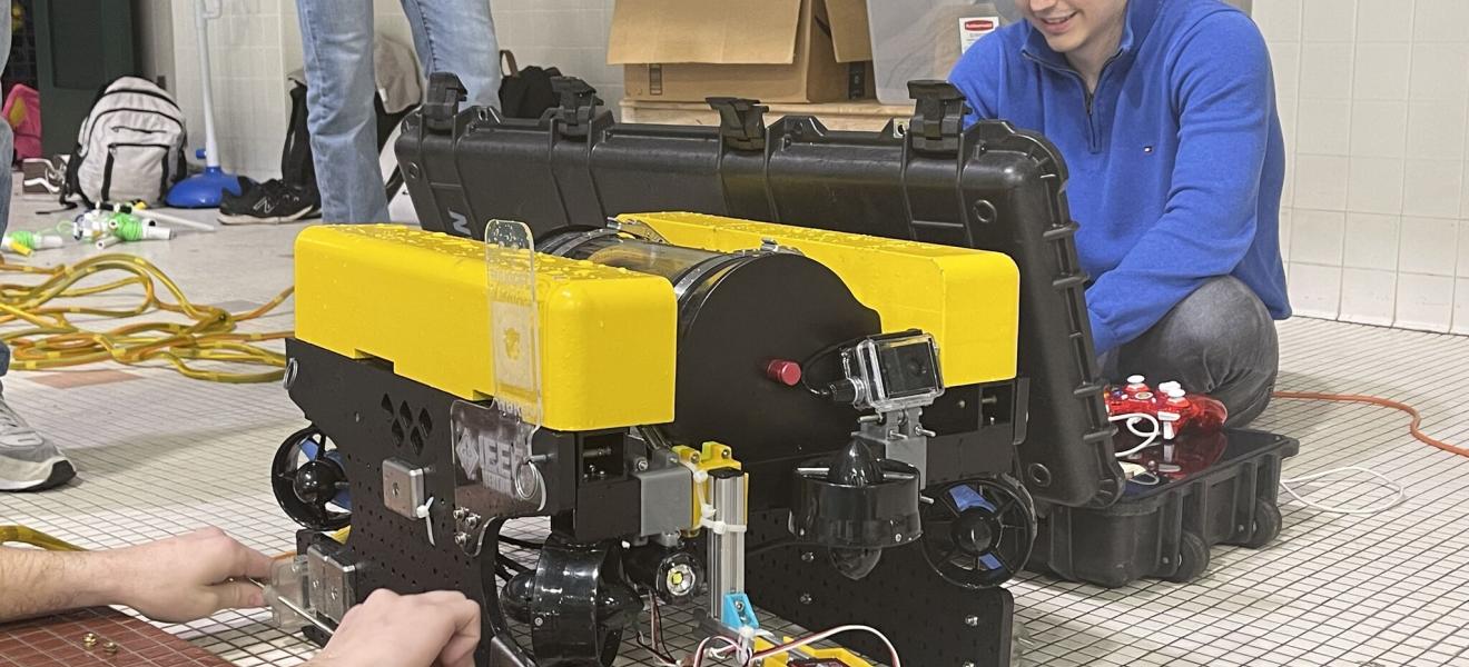student works on a robot