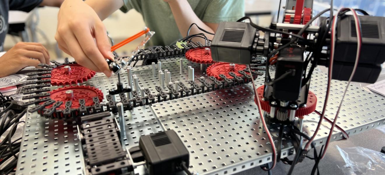 student working on a robot