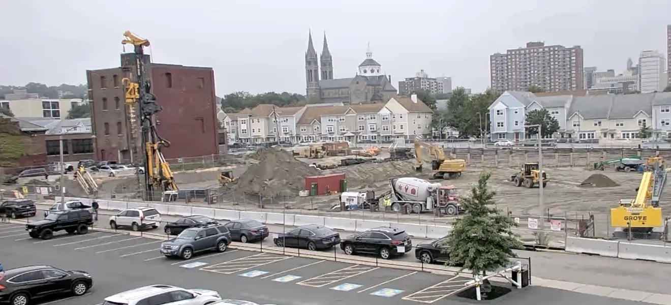 construction site showing an excavator and other equipment