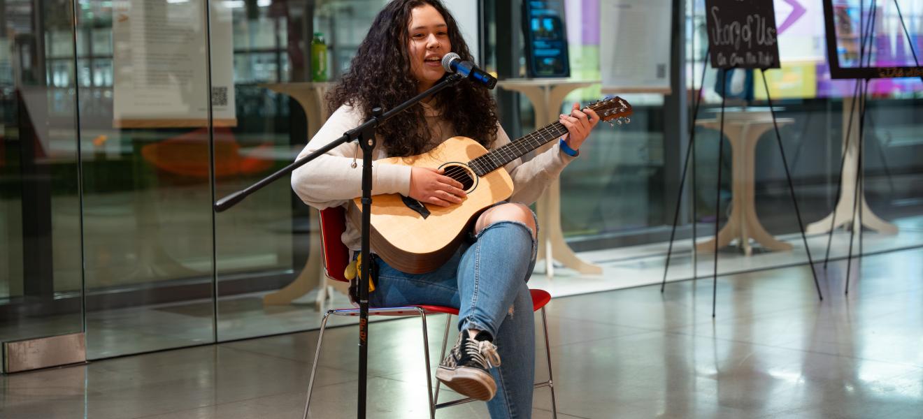 woman playing a guitar