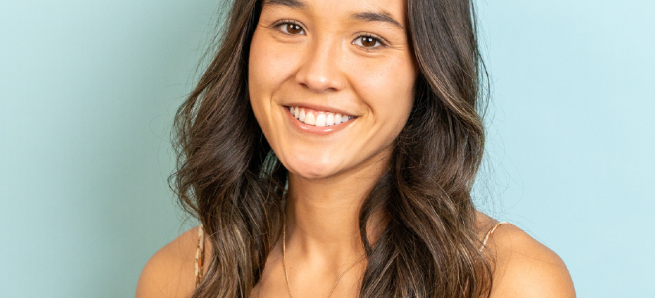 portrait of a woman with a light blue background