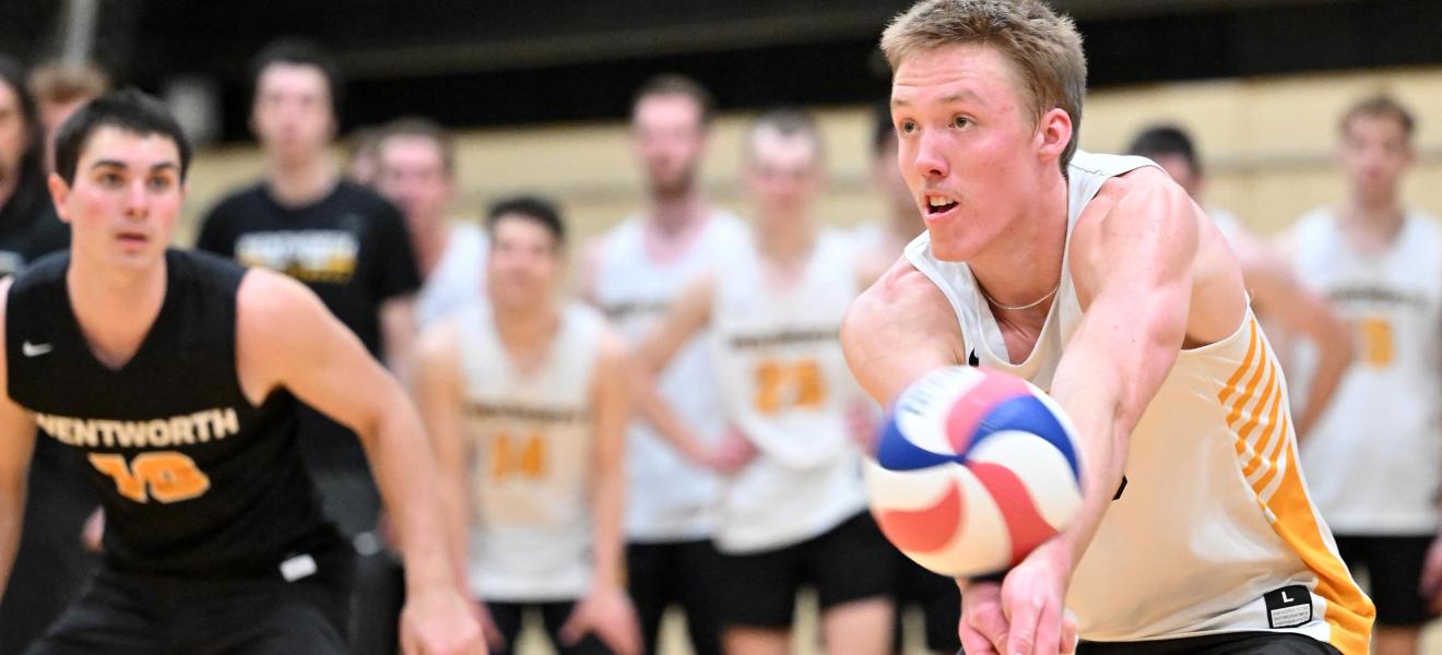 man hitting a volleyball