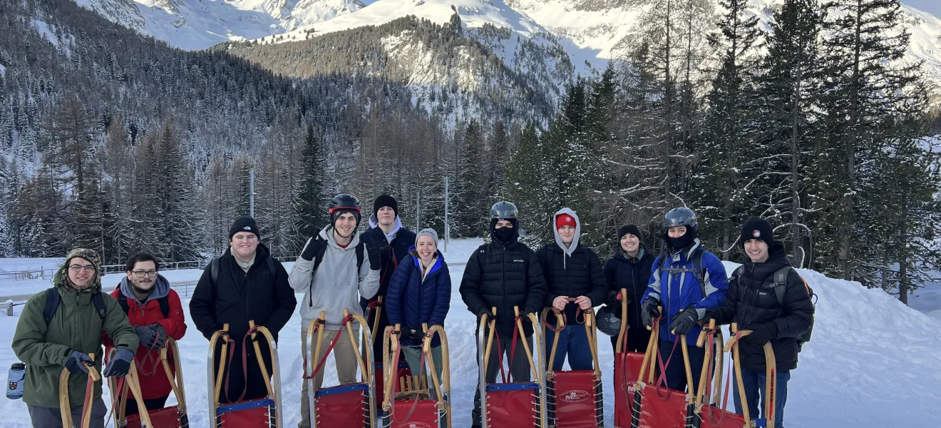 people standing on a snow-covered mountain