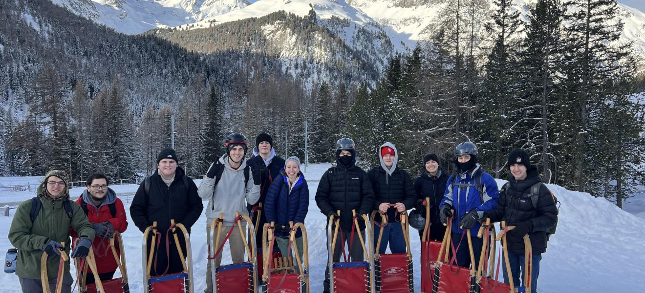 people standing on a snow-covered mountain