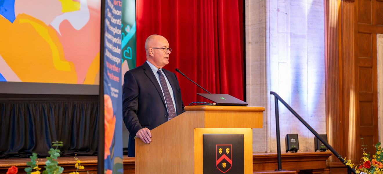 man speaking at a podium