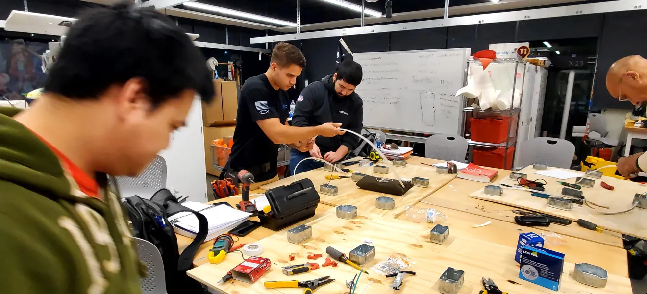 students at a worktable 