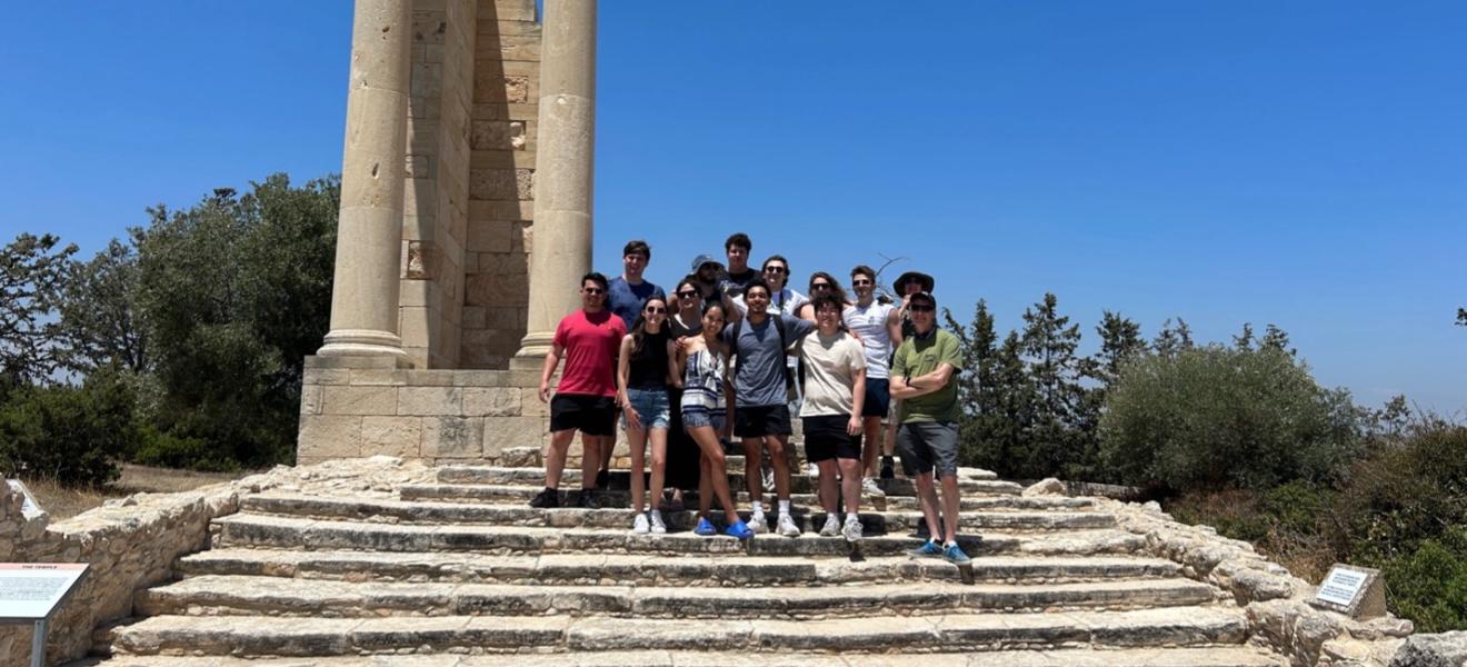 students on stone steps in Greece