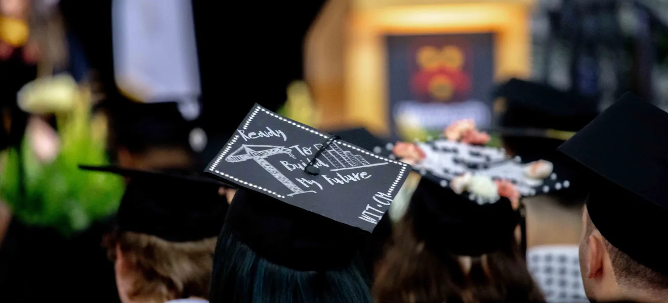 back of the head of a person wearing a graduation cap