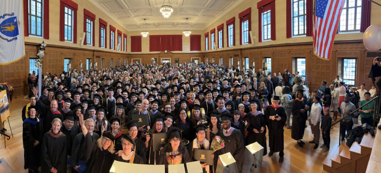 School of Architecture & Design students all together dressed in caps and gowns at commencement.