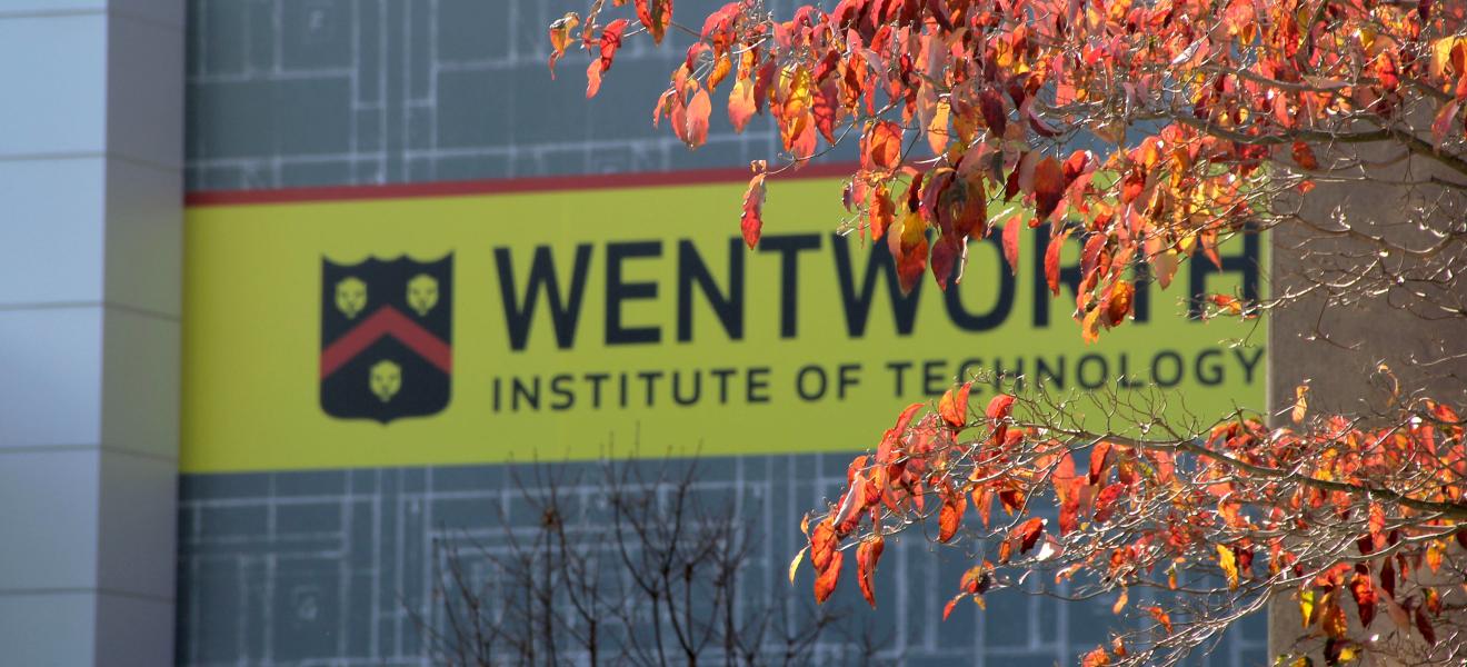 colorful leaves in front of sign that reads "wentworth"