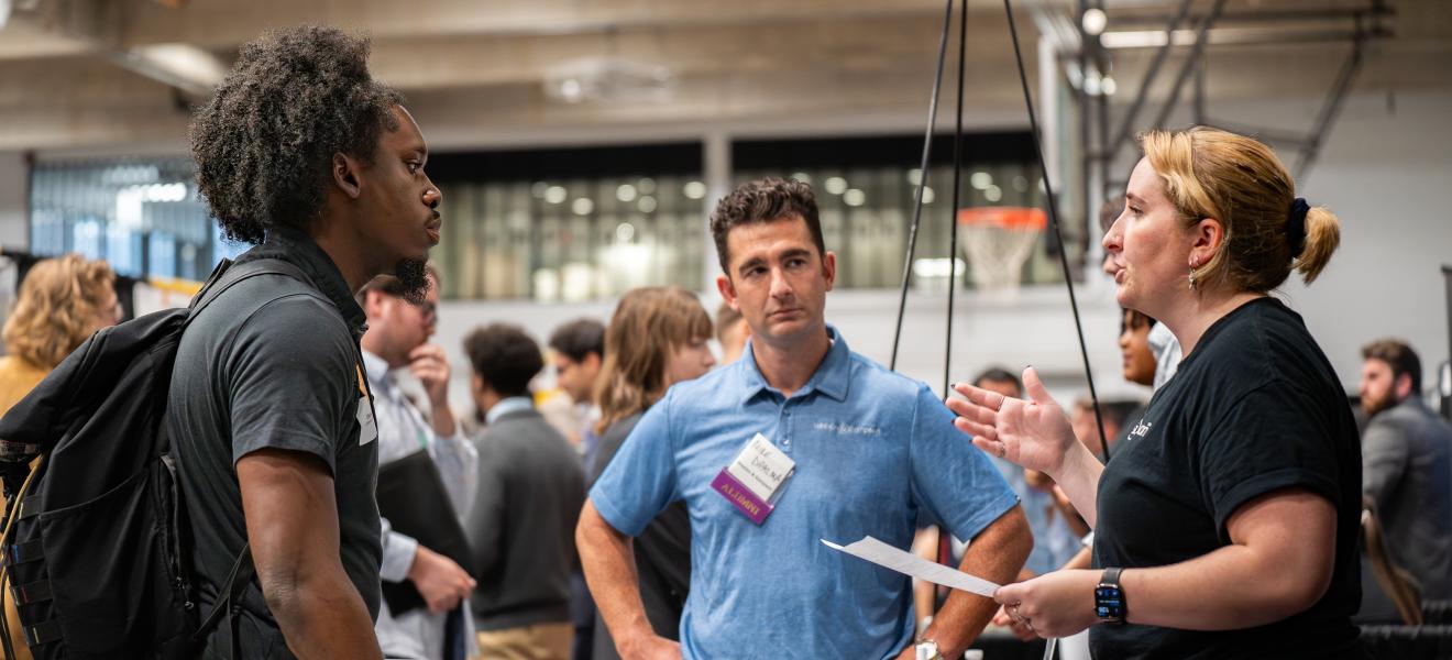 people having a conversation at a career fair