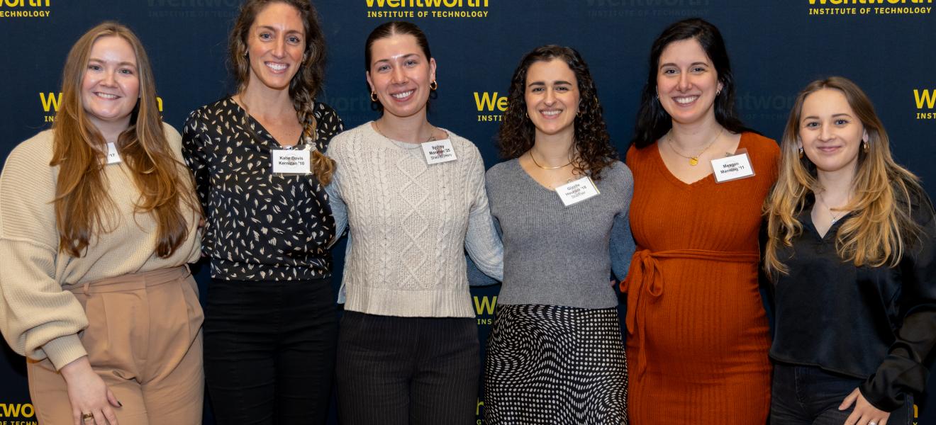 a group of women posing for the camera
