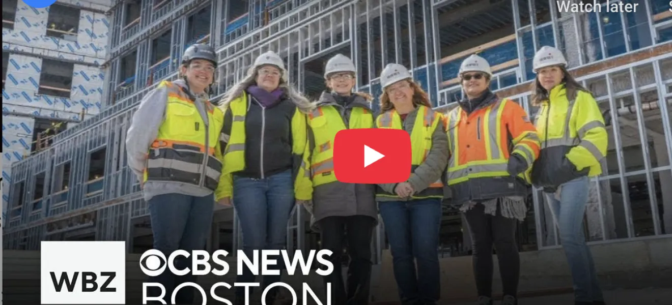 screenshot of a video player showing women in construction