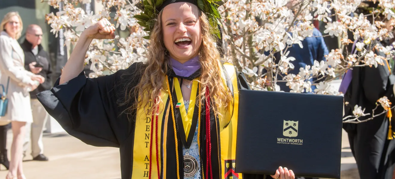 a joyful woman in a graduation robe