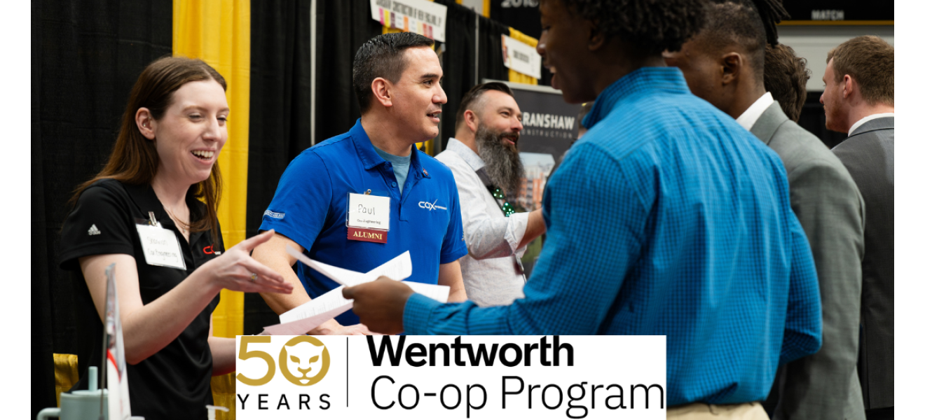 people at a career fair greet one another with smiles