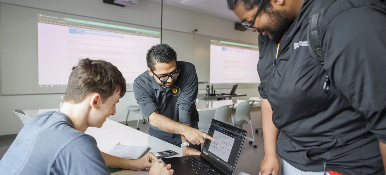 a group of students working on computers